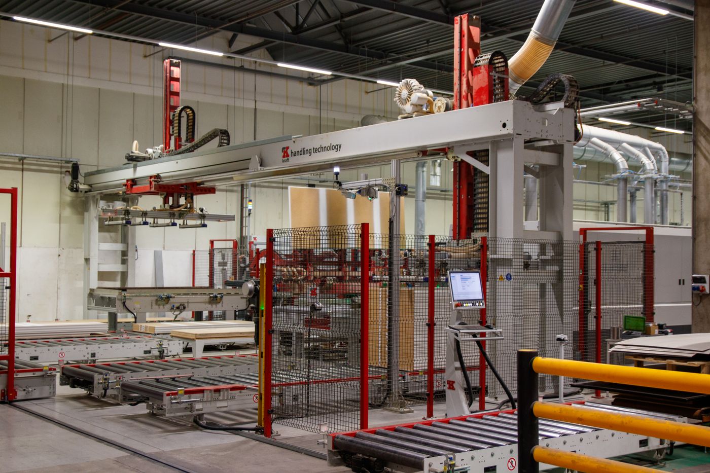 Industrial conveyor systems in a manufacturing facility