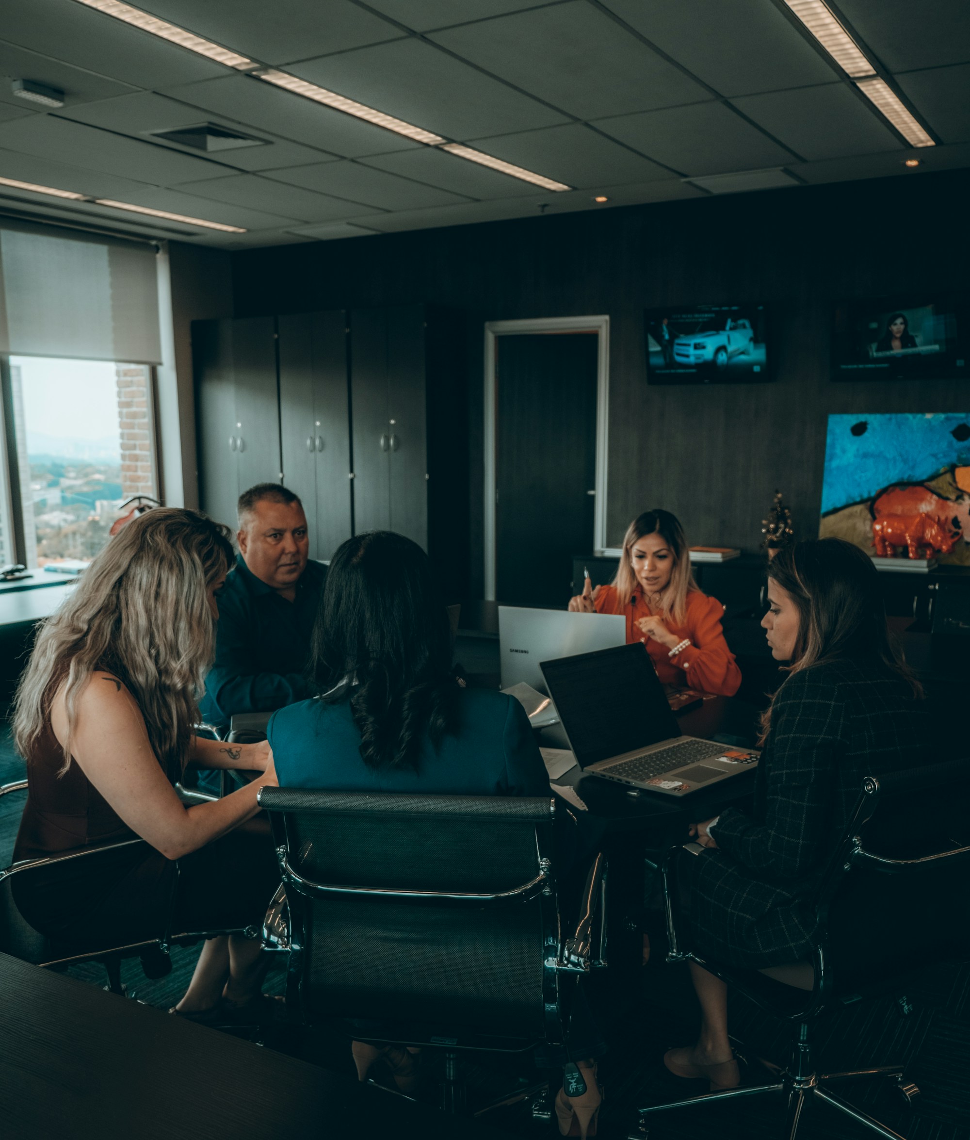 Professionals collaborating around a meeting table