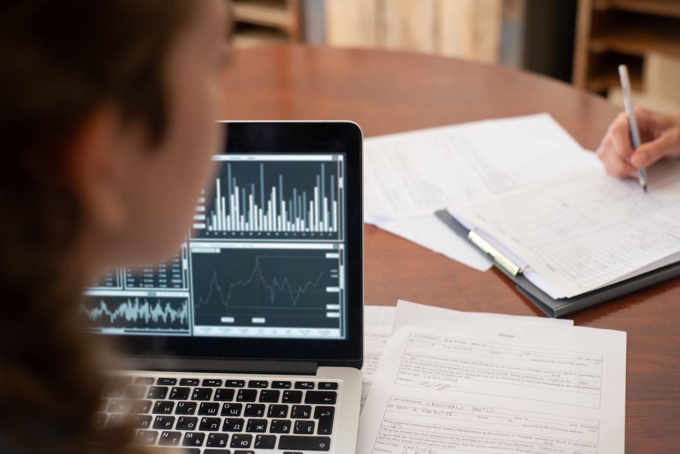 Business records and analytics being checked at a meeting